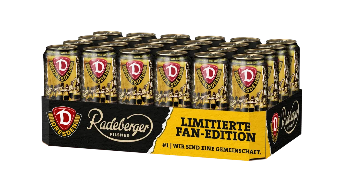 Kiste mit 24 Radeberger Pilsner Dosen in limitierter Fan-Edition. Gelbes Design mit Dresden-Logo und Slogan Wir sind eine Gemeinschaft.